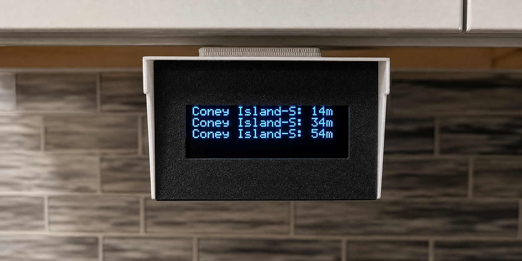 The finished train arrival board in a 3D-printed case.